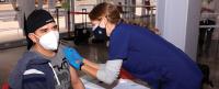 A community member gets vaccinated in April 2021 at a pop-up vaccination site at Columbia’s Community Wellness Center on the Manhattanville campus
